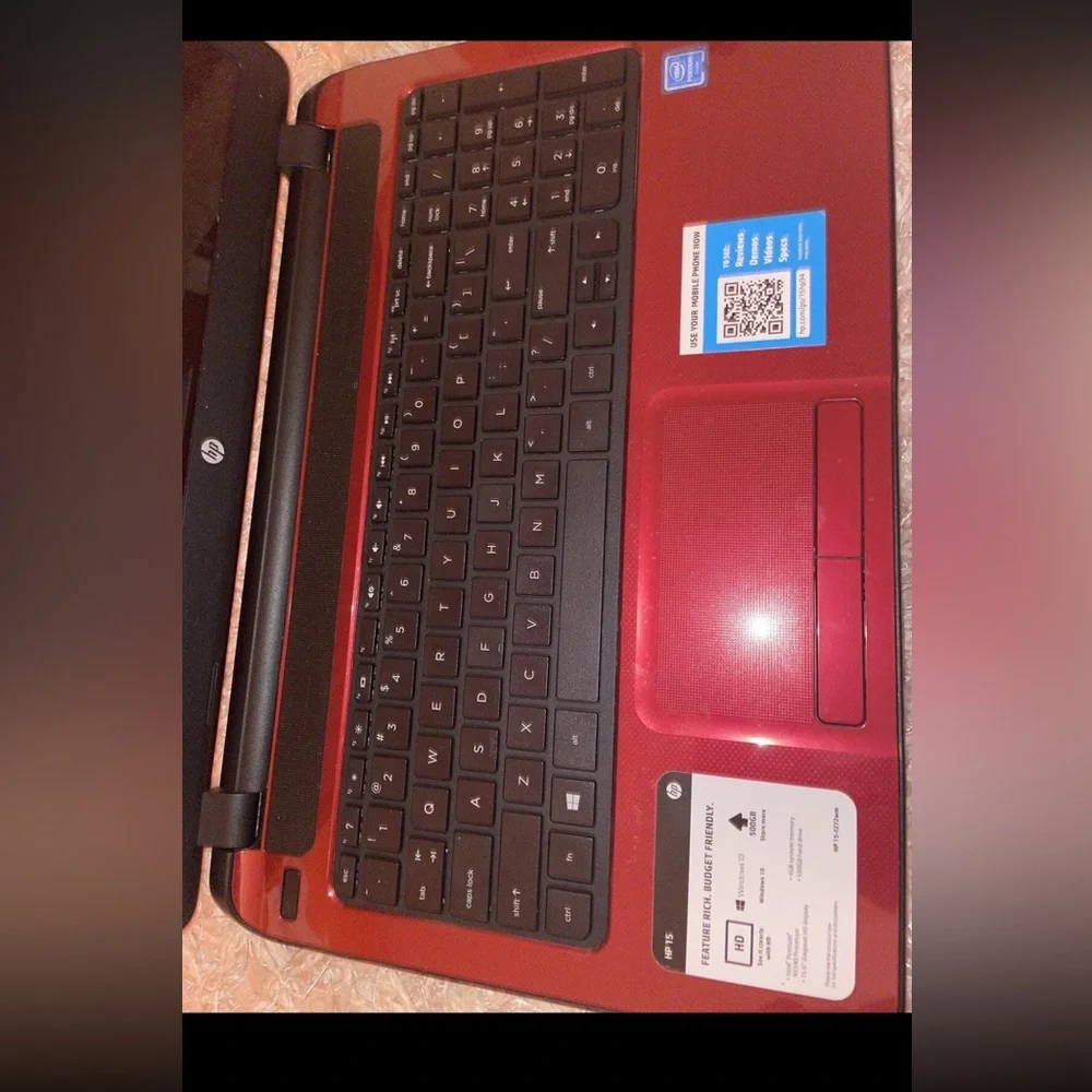 Computer with its charger and a bag